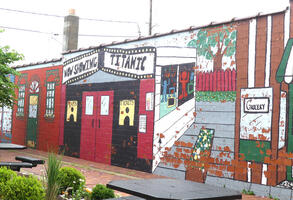 Mural of a movie theater on side of building
