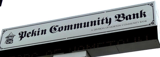 Sign for Pekin Community Bank in an old gothic-style font