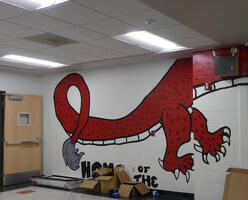 Tail of dragon painted on wall near trophy case
