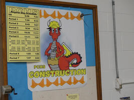 Poster of dragon wearing hard hat and tool belt. Text: PCHS Construction