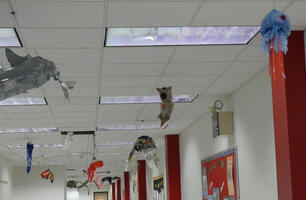 Artwork of sea creatures hanging from ceiling.