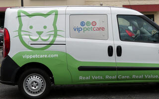 Van for vip pet care; shows cat on side.