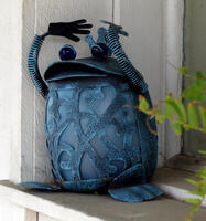 Blue ceramic frog with metal springs for front legs