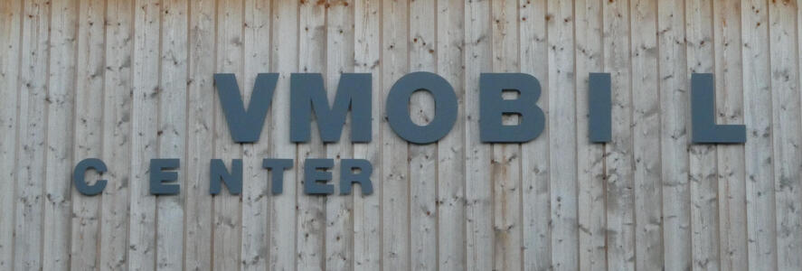 VMOBIL CENTER: the letters become more widely spaced in VMOBIL and more closely spaced in CENTER.