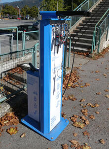 Bicycle repair station with air pump.