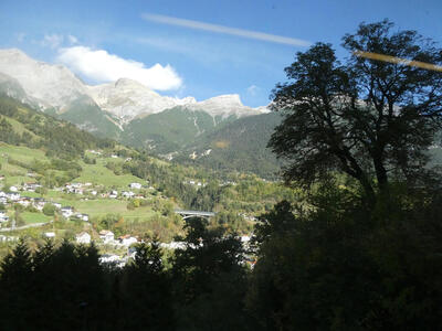 Mountains in background, small village in midground