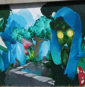 Trees at left, person with green face, yellow eyes, and blue headscarf at right.