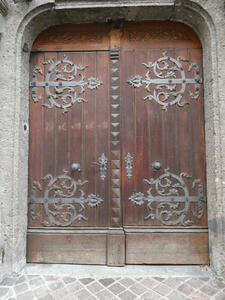 Wooden door with ornate metalwork