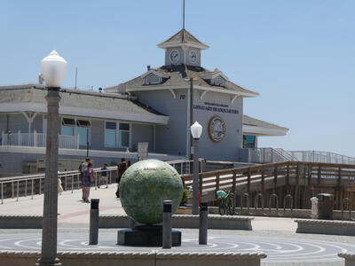 Wooden building with cupola and clock in cupola