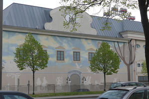 Building with pastel painting of clouds