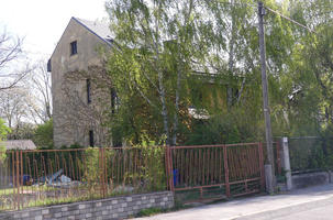 Two-story house with metal gate