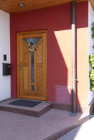 Wooden door with ornament in shape of squirrel